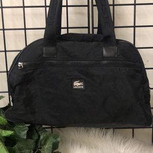 Lacoste duffle bag black color  clean measurements are 18”  wide 11” high